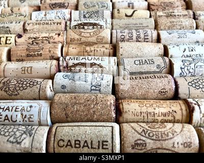 Display of assorted wine corks laid out in rows including quality fine French wines. Stock Photo
