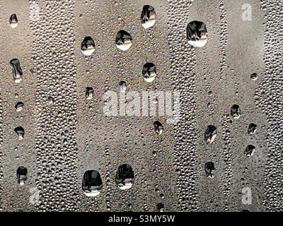Droplets of water and condensation on a window pane Stock Photo
