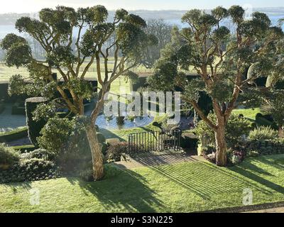 The parterre of a Rutland country house hotel in early morning sunlight Stock Photo