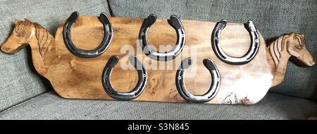Hand carved wooden horse coat hook Stock Photo