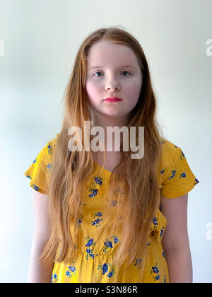 A 4 year old girl with ginger hair on her first day of school Stock ...