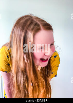 Young 11 year old girl laughing Stock Photo