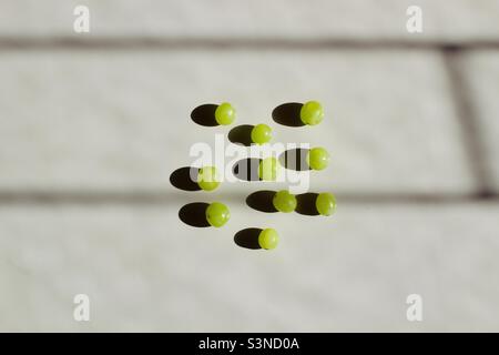 Green grapes on the white background Stock Photo