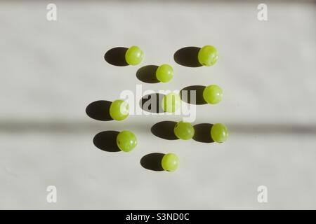 Green grapes on the white background Stock Photo