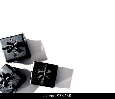 Three gift boxes with bows on a white background Stock Photo - Alamy