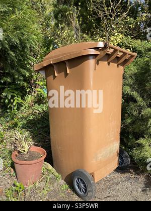 Brown garden waste wheelie bin Stock Photo