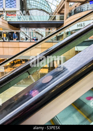 Escalators in retail shopping park Stock Photo