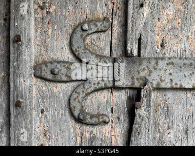 The iron work strap hinge on the door of Cotheridge Parish Church in closeup Stock Photo