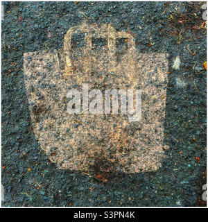 Paper grocery bag ground into the asphalt Stock Photo