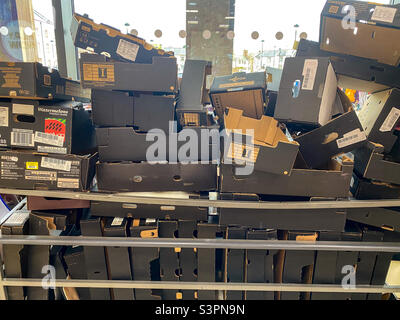 Waste cardboard boxes piled up at a supermarket. Stock Photo