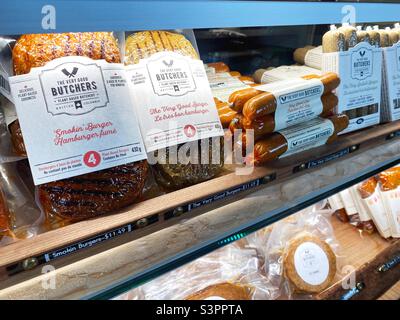 A display case with vegan meats at the Very Good Butchers in Victoria, British Columbia, Canada. Stock Photo