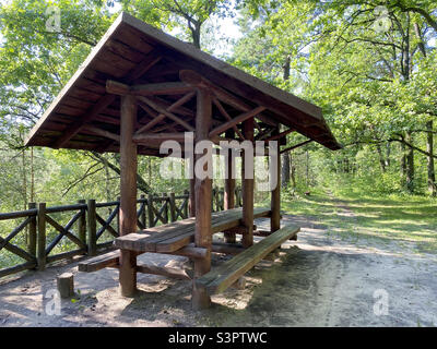 Wooden gazebo for vacationers in the forest Stock Photo