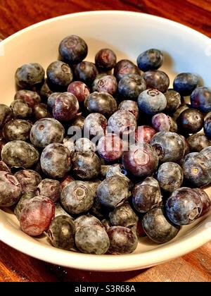 Fresh blueberries in white bowl Stock Photo