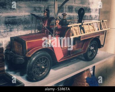 Vintage tin fire truck toy on display at antique mall Stock Photo