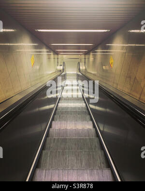 Escalator in Milan Duomo subway station. Italy. Stock Photo