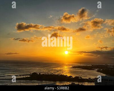 Golden sunset at Waikiki Beach, Honolulu, Oahu, Hawaii USA Stock Photo