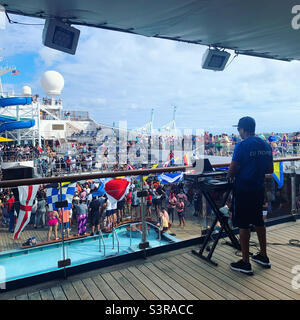 March, 2022, DJ at the Sailaway Party for the Carnival Conquest cruise ship leaving Miami, Florida for a Bahamas cruise Stock Photo