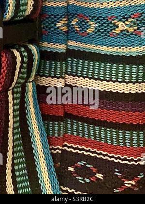 Closeup Burgundy Blue and Natural Colors Boho Fabric Backpack Stock Photo