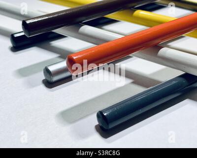 Colored pencils piled up on spacing. Stock Photo