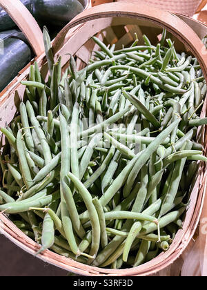 Fresh organic just picked string green beans for sale at a local farmers market. Stock Photo