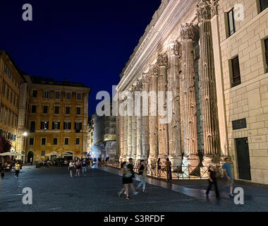 The surviving colonnade of the ancient Roman Temple of Hadrian, now incorporated into the Chamber of Commerce, at the Piazza di Pietra in Rome, Italy Stock Photo