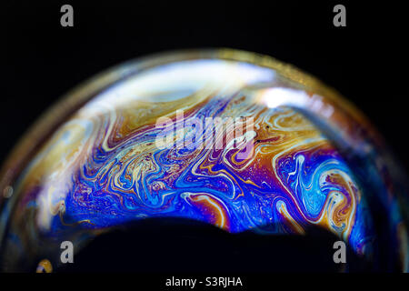 Abstract pattern, multicolored texture inside of the soap bubble, macro photography Stock Photo
