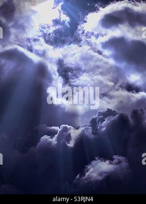 Dramatic clouds over Utah, USA. Sunlight rays have been digitally added for artistic effect. Stock Photo