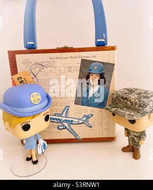 Vintage pan Am flight attendant memorabilia cigar box purse on display with two Funko pop characters, 2022, USA Stock Photo