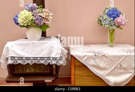 Two bouquets of hydrangeas in two vases Stock Photo