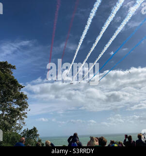 Red arrows display at an air show at n Folkestone Stock Photo