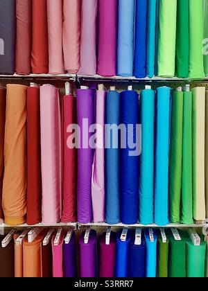 Three vertical rows of colorful, vibrant, fabric samples Stock Photo