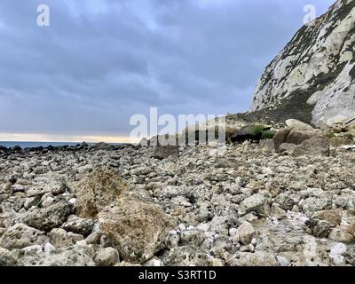 Chalk and flint pebbles and rocks on a beach Stock Photo