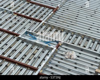 A grid of galvanised metalwork, the roof structure of a new building in Worcester UK Stock Photo