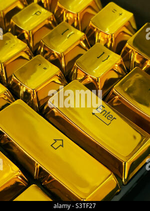 Enter key on a golden keyboard Stock Photo