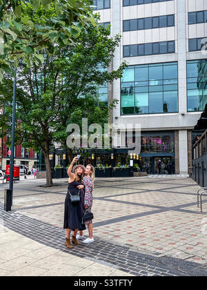 Two women taking a selfie in Leeds city centre Stock Photo