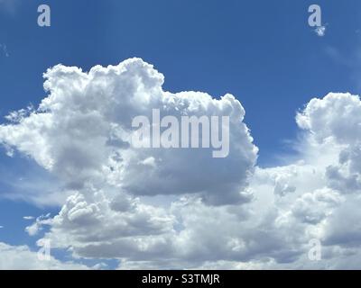 Beautiful cumulus clouds decorate the skies over the Salt Lake valley in Utah, USA in July on a nice summer day. Stock Photo