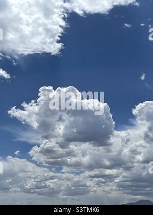 Beautiful cumulus clouds decorate the skies over the Salt Lake valley in Utah, USA in July on a nice summer day. Stock Photo