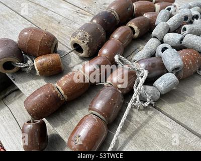 Japanese lead and ceramic fishing weights Stock Photo