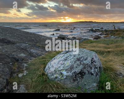 A Sunset at The baltic sea on the Swedish West Coast during a summer Storm Stock Photo