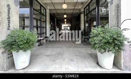LOS ANGELES, CA, APR 2022: wide view passage through building at The Row, repurposed industrial buildings now used as a creative, light manufacturing and retail area in Produce District, Downtown Stock Photo
