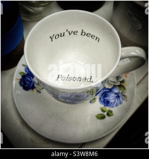Teacup with humorous quote inside Stock Photo