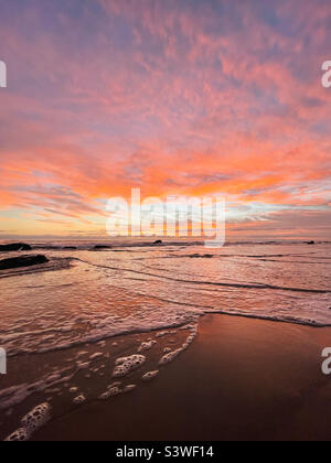 Dramatic beach sunset Stock Photo