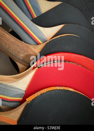 Six table tennis paddles lying on Top of each other Stock Photo