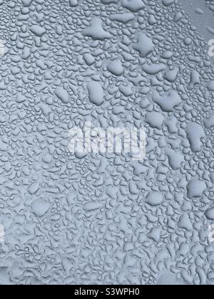 Water droplets on silver surface Stock Photo