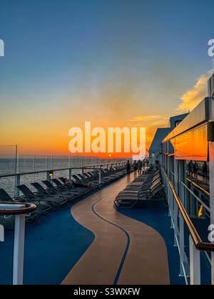 Sunset in the Atlantic Ocean on Royal Caribbean Anthem of the Seas deck Stock Photo