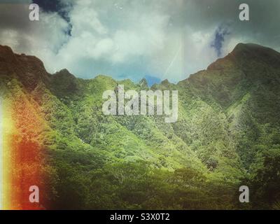 Mountain ridge covered in lush green tropical vegetation. Stock Photo
