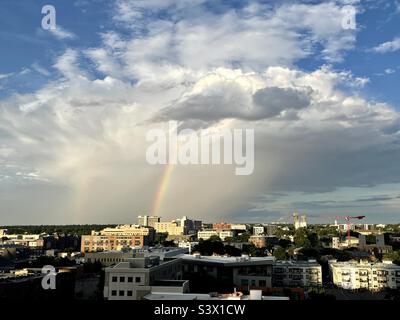 A rainbow amongst the clouds over the Denver skyline in Colorado USA Stock Photo