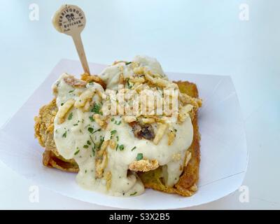 Vegan chicken with gravy on toast made by The Herbivorous Butcher in Minneapolis, Minnesota, at their Minnesota State Fair booth. Stock Photo