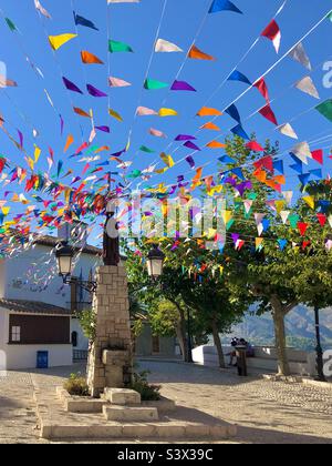 Guadalest old town, Valencia. Fiesta decorations in town square. Stock Photo