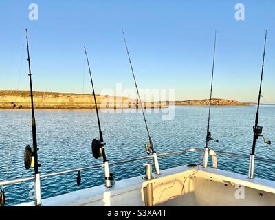 Fishing rods with reels on the boat in natural setting Stock Photo